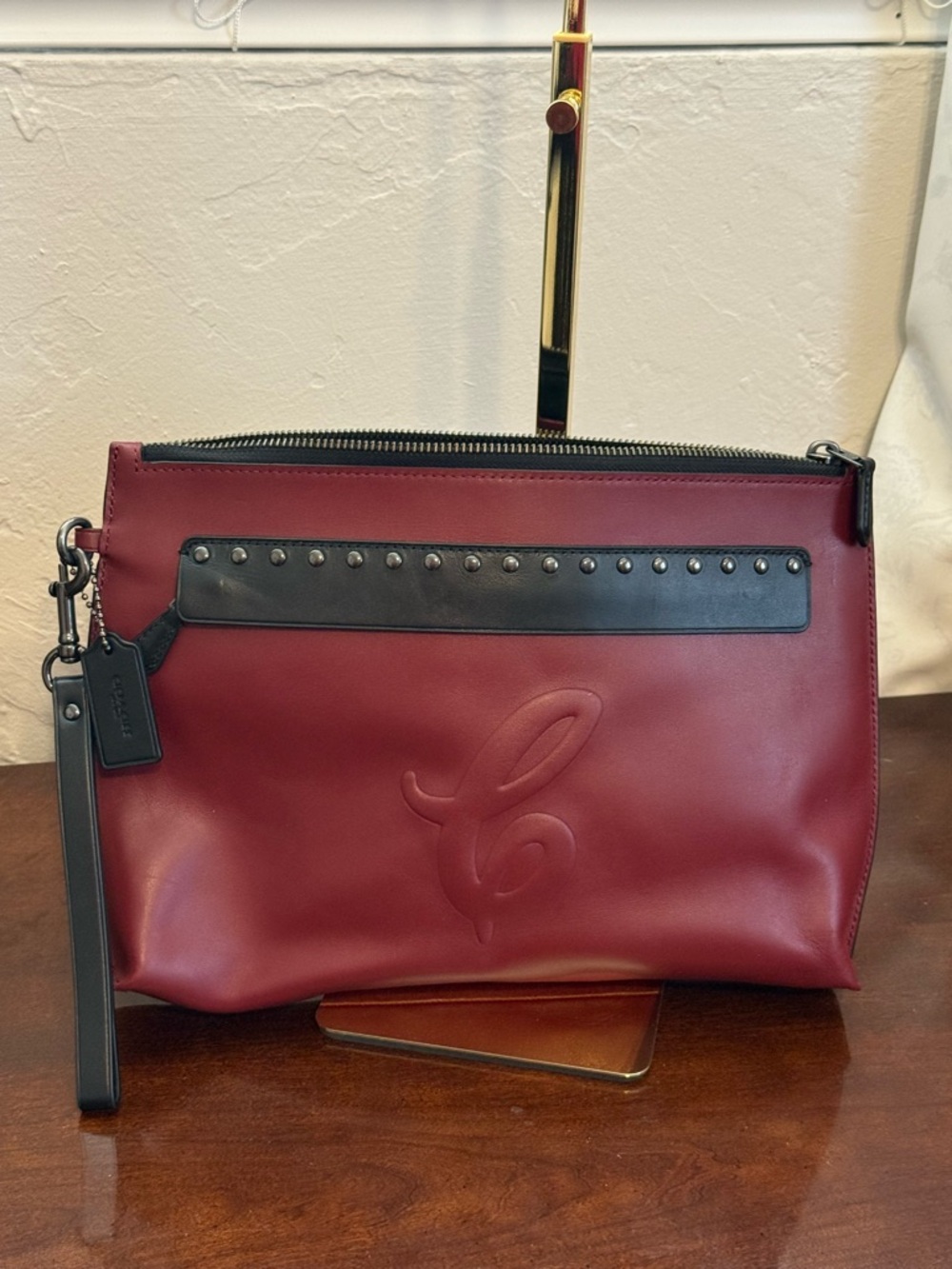 Coach Burgundy Leather Clutch with Black Studded Trim